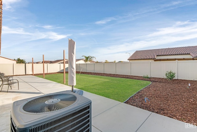 view of yard featuring a patio and central air condition unit