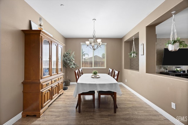9318 Poseidon St, Bakersfield, CA 93306 - dining area with a chandelier and wood finished floors
