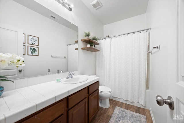 9318 Poseidon St, Bakersfield, CA 93306 - bathroom with wood finished floors, vanity, and shower / tub combo with curtain