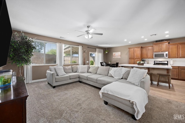 9318 Poseidon St, Bakersfield, CA 93306 - living area featuring recessed lighting, a ceiling fan, and light carpet