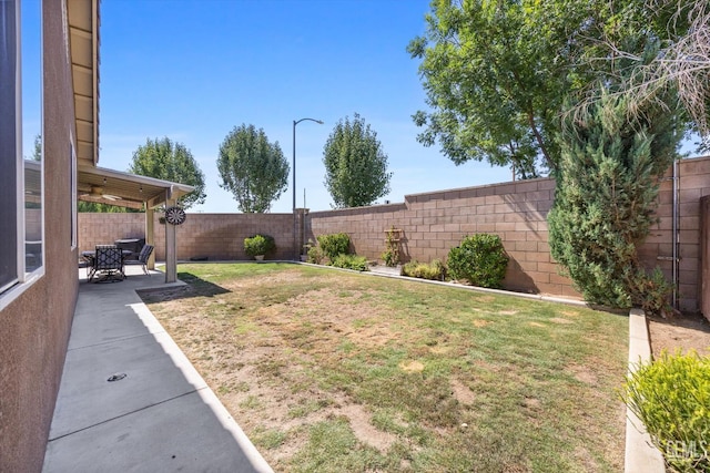 9318 Poseidon St, Bakersfield, CA 93306 - fenced backyard featuring a patio