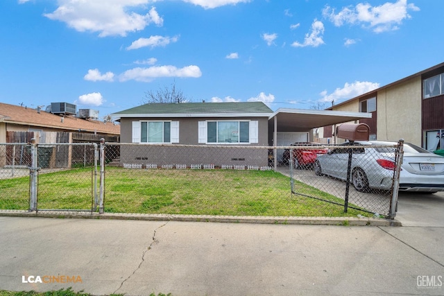 view of front of house with driveway, a fenced front yard, a gate, a carport, and a front yard