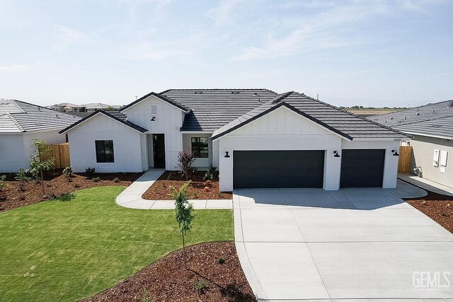 16615 Chloe Ct, Bakersfield, CA 93314 - modern farmhouse style home featuring a tiled roof, driveway, a garage, fence, and a front lawn
