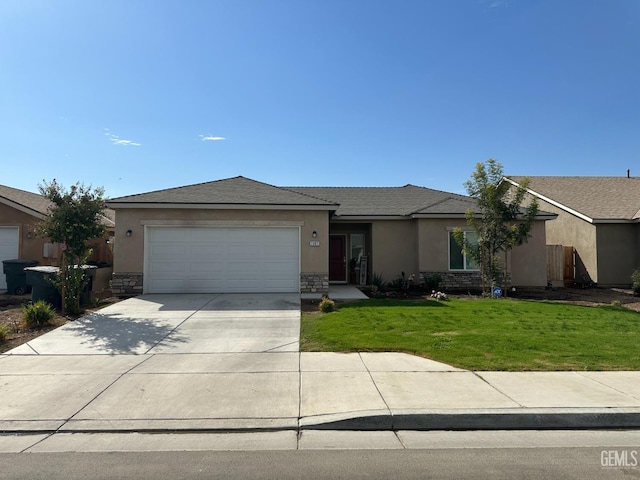 view of front of house with a garage and a front lawn