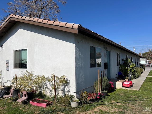 view of home's exterior with a yard