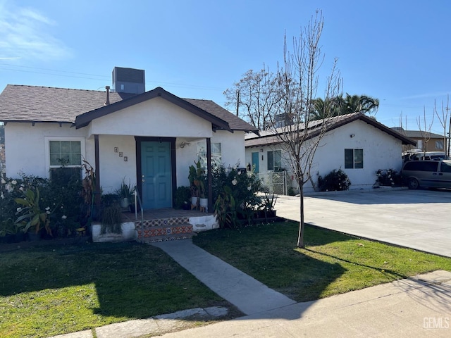 ranch-style house with a front lawn and central AC unit