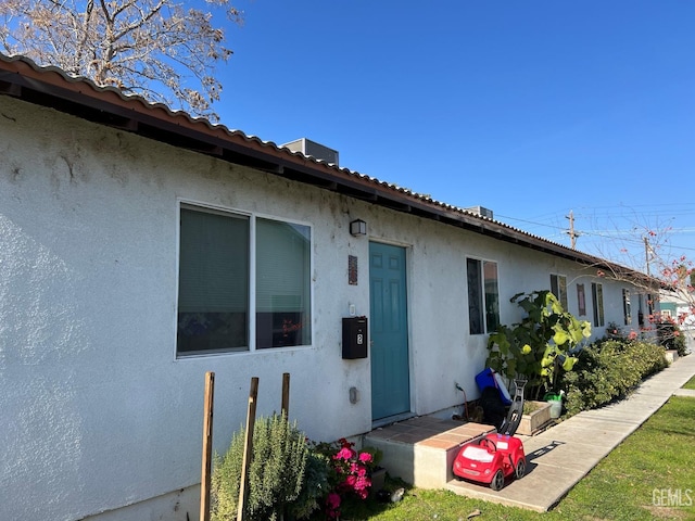 rear view of property with a yard