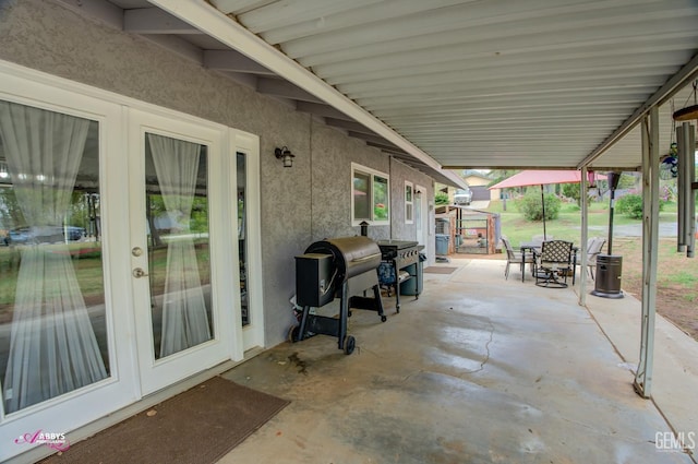 view of patio / terrace with outdoor dining area, grilling area, and french doors