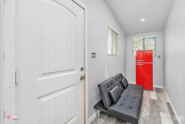 doorway to outside featuring baseboards, recessed lighting, and wood finished floors
