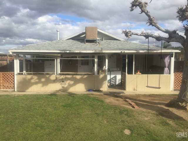 back of house featuring a yard