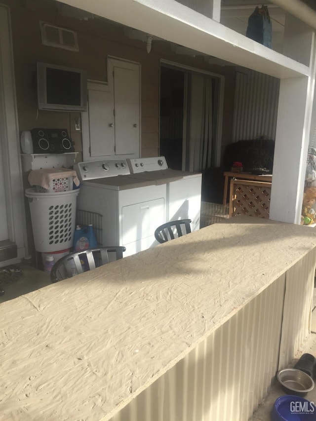 kitchen featuring independent washer and dryer