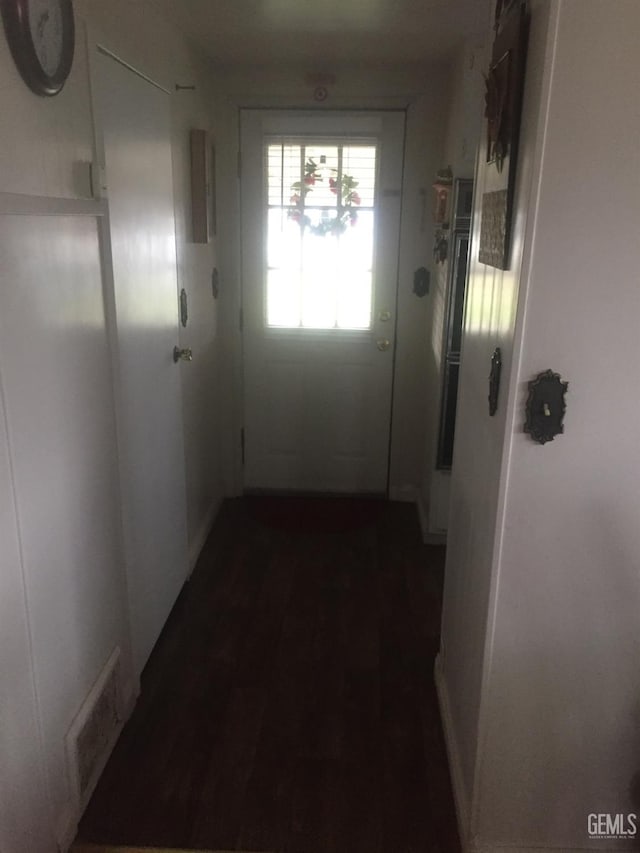 entryway with dark wood-type flooring