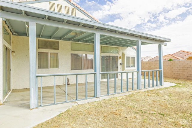 view of patio / terrace featuring fence