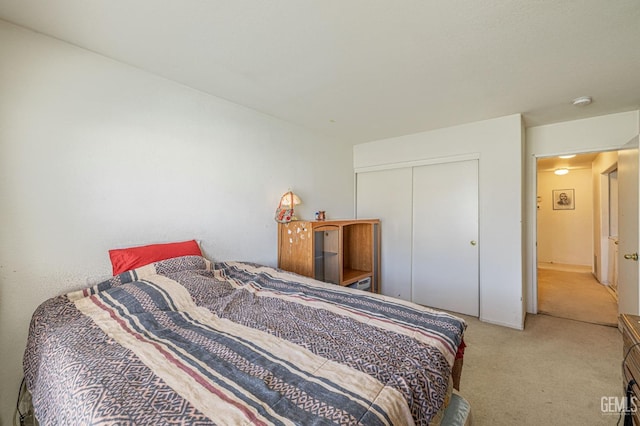 bedroom with carpet floors and a closet