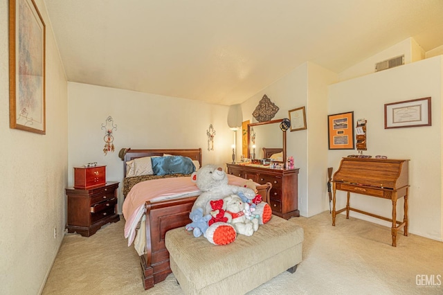 bedroom featuring lofted ceiling, visible vents, and light colored carpet