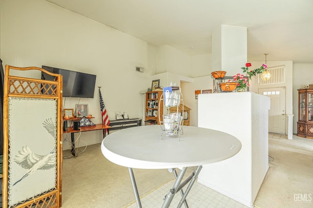 dining area featuring carpet