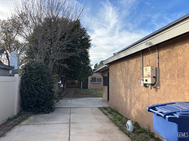 view of side of home featuring a patio area