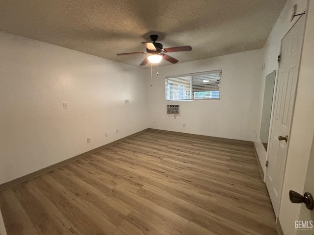 unfurnished bedroom featuring ceiling fan, light hardwood / wood-style flooring, and a textured ceiling