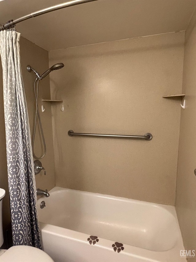 bathroom featuring toilet and shower / tub combo