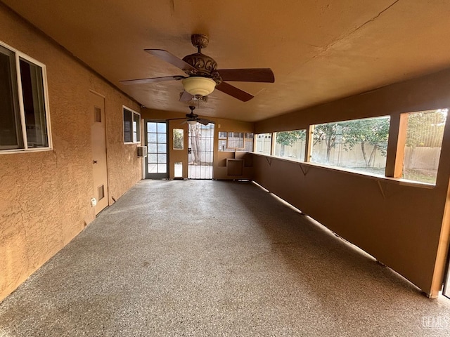 unfurnished sunroom with lofted ceiling and a wealth of natural light