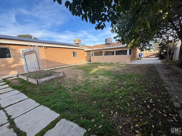 view of yard with central AC unit