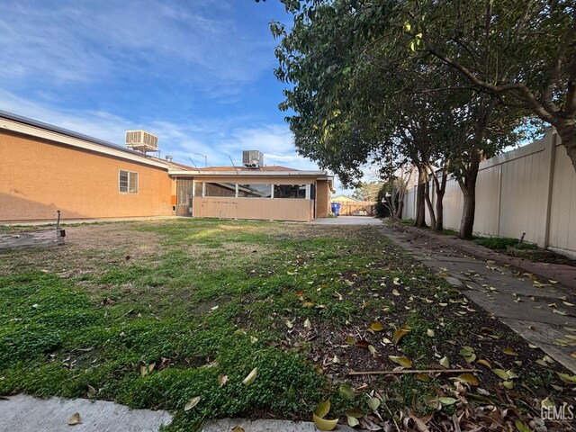 view of yard featuring central air condition unit