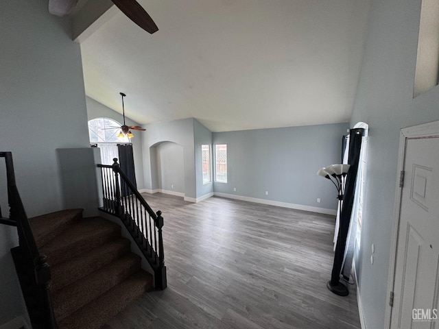 6100 Aruba Ct, Bakersfield, CA 93313 - staircase with baseboards, wood finished floors, arched walkways, and ceiling fan