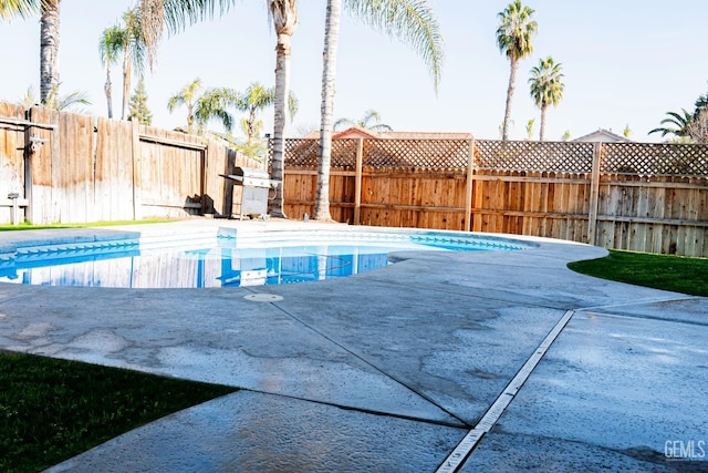6100 Aruba Ct, Bakersfield, CA 93313 - view of pool featuring a fenced in pool, a patio, a fenced backyard, and grilling area