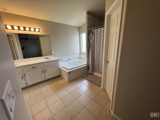 6100 Aruba Ct, Bakersfield, CA 93313 - full bath with tile patterned flooring, a jetted tub, lofted ceiling, double vanity, and a sink