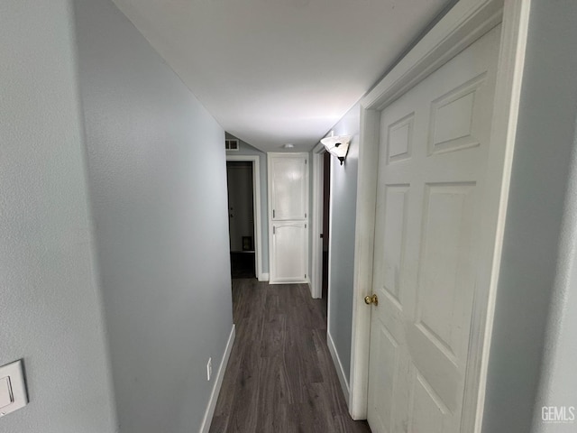 6100 Aruba Ct, Bakersfield, CA 93313 - corridor with dark wood-type flooring, baseboards, and visible vents
