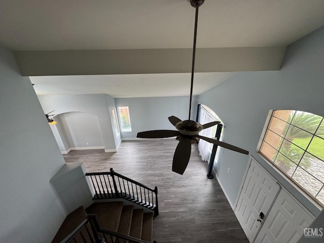 6100 Aruba Ct, Bakersfield, CA 93313 - stairway featuring baseboards, arched walkways, wood finished floors, and a ceiling fan