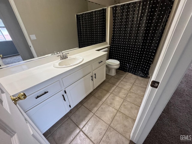 6100 Aruba Ct, Bakersfield, CA 93313 - bathroom featuring tile patterned floors, toilet, a shower with shower curtain, and vanity