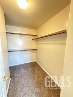 6631 Rimridge Way, Bakersfield, CA 93313 - spacious closet featuring carpet floors