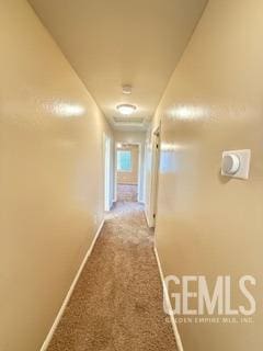 6631 Rimridge Way, Bakersfield, CA 93313 - corridor with baseboards and carpet flooring