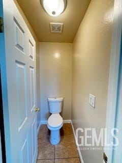 6631 Rimridge Way, Bakersfield, CA 93313 - bathroom with baseboards, toilet, and tile patterned floors