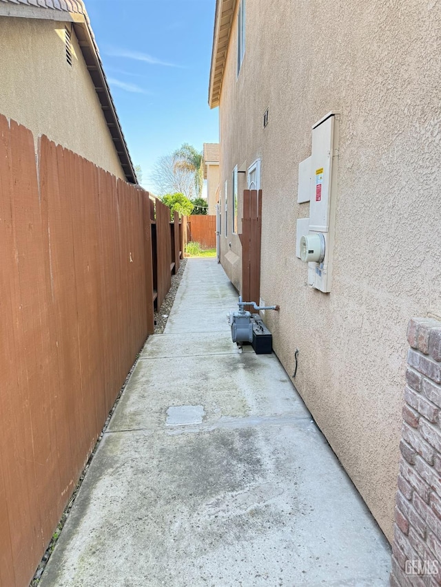 6631 Rimridge Way, Bakersfield, CA 93313 - view of property exterior featuring stucco siding and fence