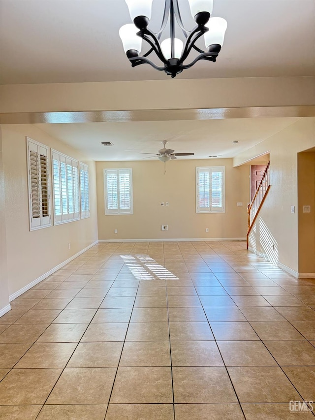 6631 Rimridge Way, Bakersfield, CA 93313 - unfurnished room featuring plenty of natural light, a chandelier, light tile patterned flooring, and baseboards