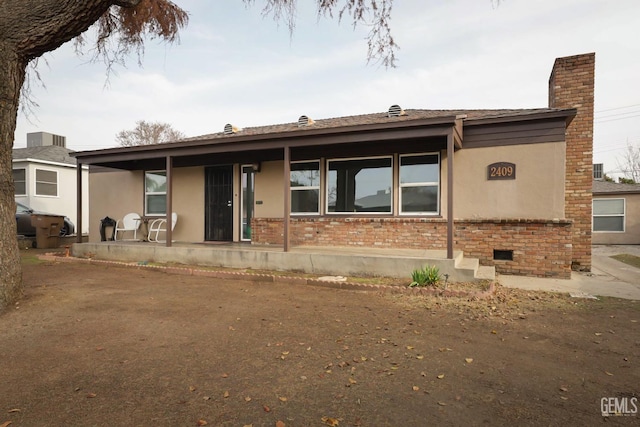 view of front of house with a patio area