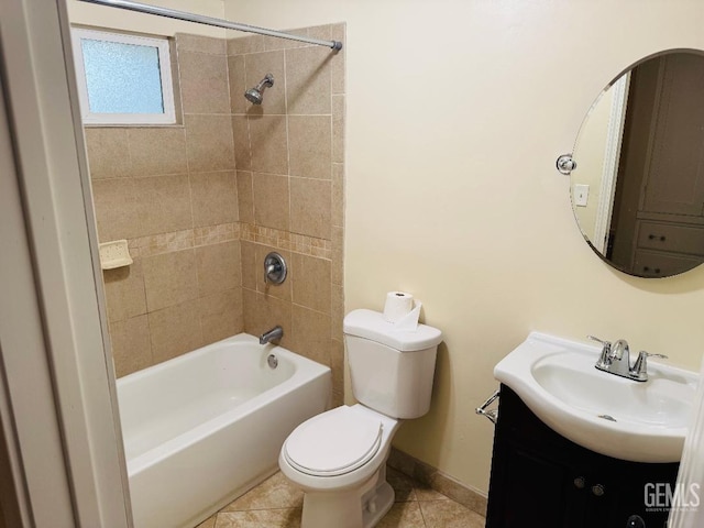 bathroom featuring baseboards, toilet, tile patterned floors, tub / shower combination, and vanity