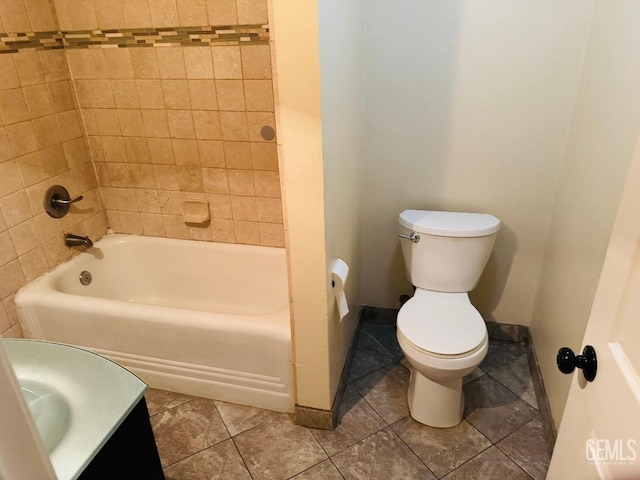 full bath with toilet, shower / tub combination, baseboards, and tile patterned floors