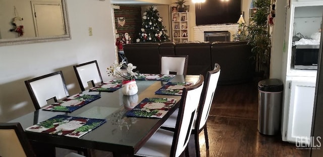 dining area with dark hardwood / wood-style flooring