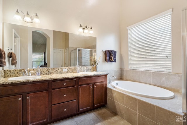 6207 Provincetown Ave, Bakersfield, CA 93313 - bathroom with a stall shower, a garden tub, double vanity, and tile patterned flooring