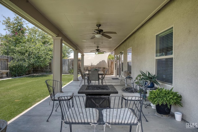 6207 Provincetown Ave, Bakersfield, CA 93313 - fenced backyard with an outdoor fire pit, a ceiling fan, a patio area, and outdoor dining area