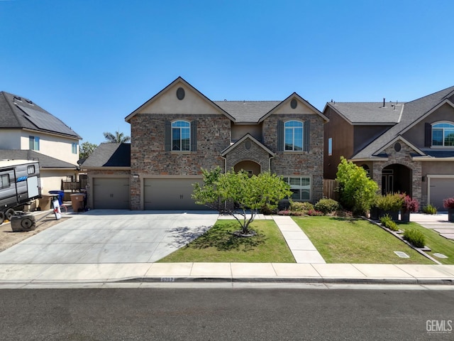 6207 Provincetown Ave, Bakersfield, CA 93313 - view of front facade with stucco siding, a front lawn, concrete driveway, stone siding, and an attached garage