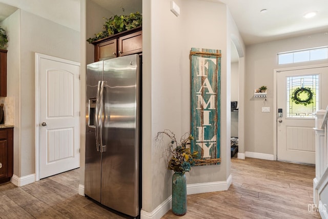 6207 Provincetown Ave, Bakersfield, CA 93313 - foyer entrance with arched walkways and light wood finished floors