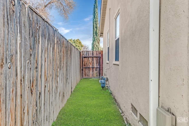 view of side of home featuring a yard