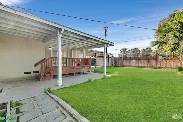 view of yard with a patio and a deck