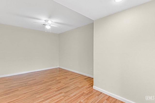 spare room featuring ceiling fan and light hardwood / wood-style floors