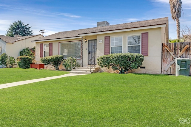 single story home featuring a front yard