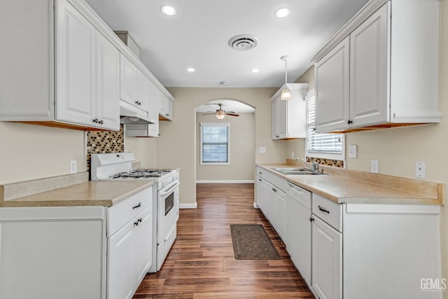 kitchen with pendant lighting, white cabinetry, sink, ceiling fan, and white appliances